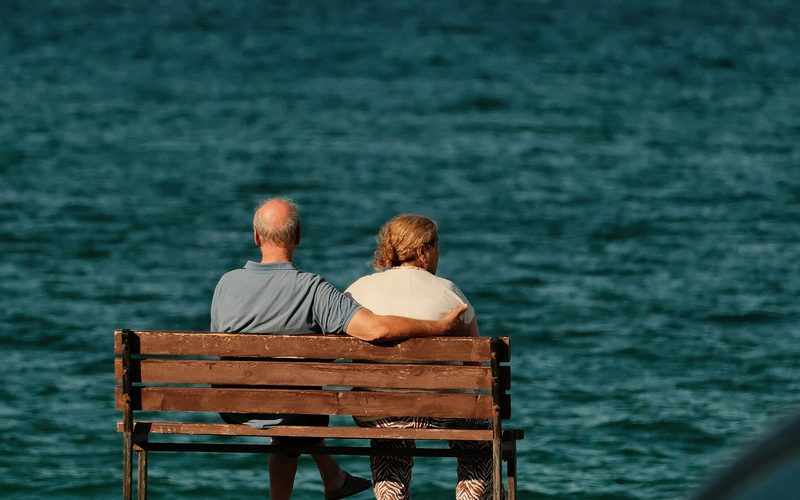Retired couple by water